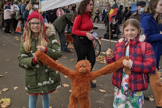 Isla Bradbury and Esme Donald both pupils of St Wilfrid's Primary in Halton with a toy monkey as they took part in Greta's march in Glasgow during COP26.