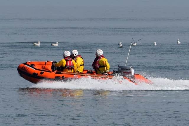 Morecambe's inshore lifeboat was launched in wild weather to reports of people trapped by the tide