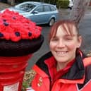 Postwoman Vicky Birchall with the poppy postbox cover her sister Carla Bonness made for her postbox on Balmoral Road in Morecambe.