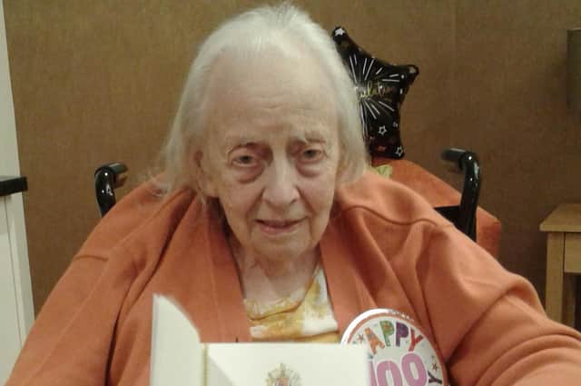 Laurel Bank care home resident Sybil Hansen with her telegram from the Queen for her 100th birthday.