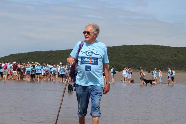 Cedric Robinson leading the Galoway's Society for the Blind Morecambe Bay walk back in 2014.