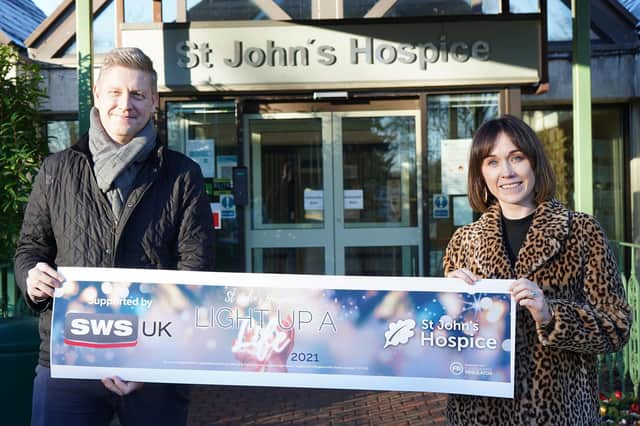 Martin Fletcher, commercial cirector at SWS UK, with Chloe Wiggins, marketing manager, outside St John’s Hospice.