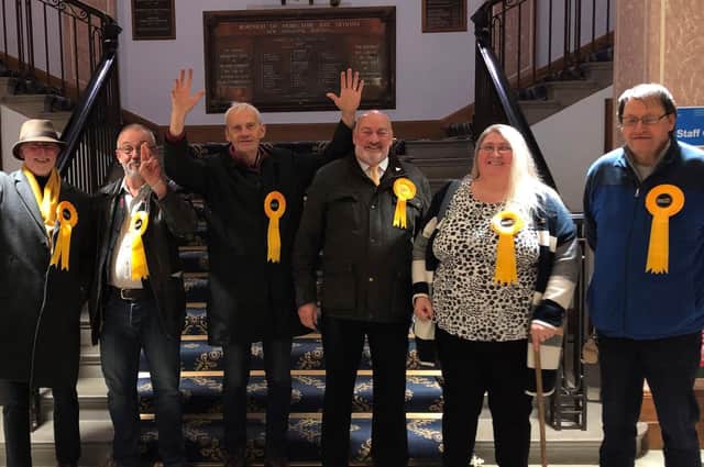 The winning Lib Dem candidates in the Morecambe Town Council by-election were Bill Jackson (fourth from the left) and Louise Stansfield (fifth from the left).