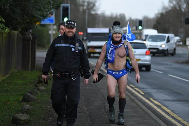Speedo Mick walking through Preston during his charity trek last year.