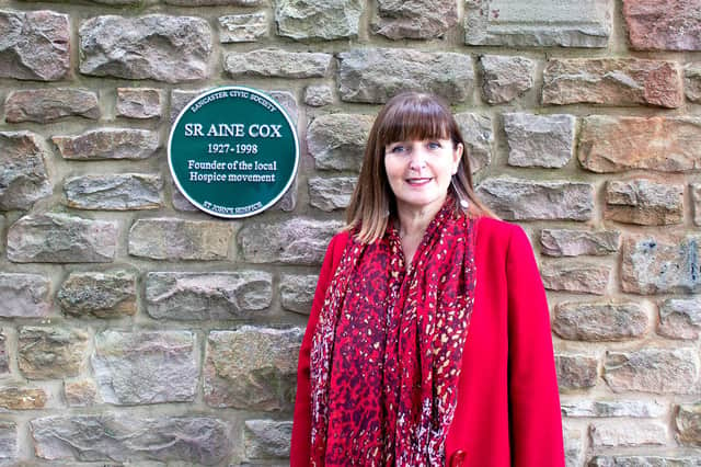 Sue McGraw, St John’s Hospice’s CEO, with the new plaque.