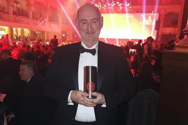 Ascentis CEO Phil Wilkinson with the Red Rose award.