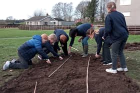 Pupils at Hornby St Margaret’s CE Primary School were joined by friends and family to plant thousands of flower bulbs in the school grounds.