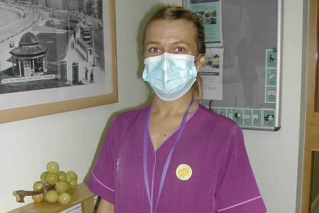 An EMH nurse with her pandemic hero medal.