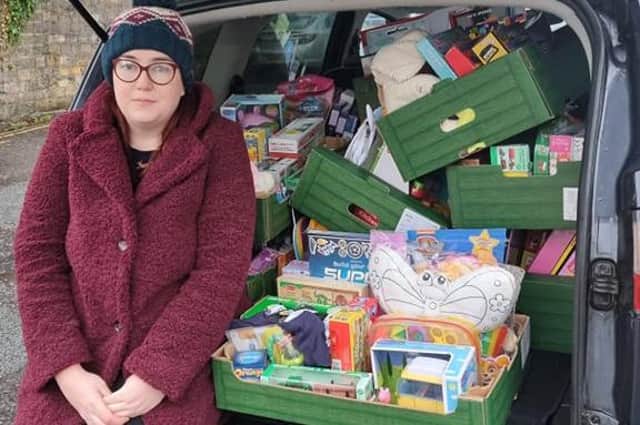 Laura Richardson with toys donated to her Christmas appeal.