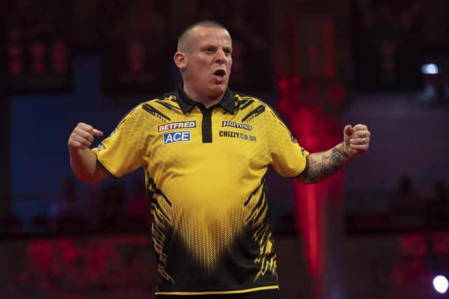 Dave Chisnall progressed at the Alexandra Palace yesterday Picture: Lawrence Lustig/PDC