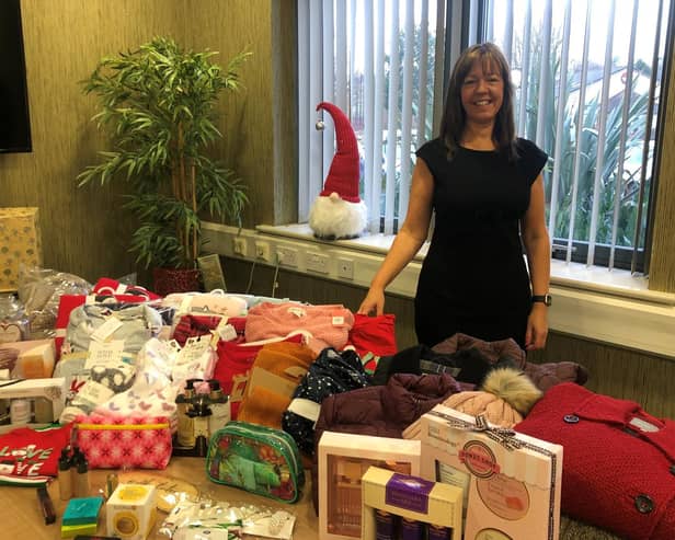 Julie Grimshaw with some of the donated items.
