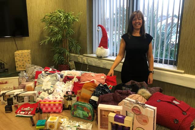 Julie Grimshaw with some of the donated items.
