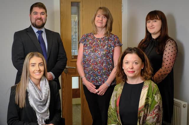 Dan Pinder, Virginia Webster and Amy Whiteside, with Mary Greenway and Lisa Lodge seated, at Vincents Solicitors office in Garstang.