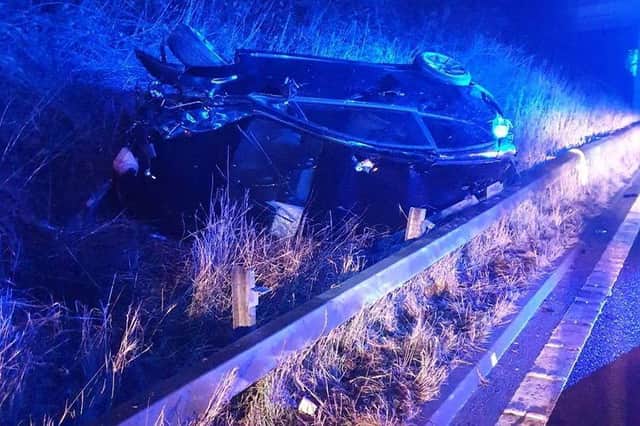 Lancs Road Police shared this image on Twitter of an upturned vehicle on the wrong side of the crash barrier on the M6.
