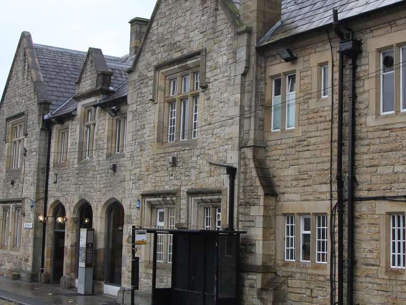 Originally known as Lancaster Castle Station in order to distinguish it from the first Lancaster Station (1840–1849), Lancaster station was officially opened on September 21 1846. The first public service ran into the station on December 17 the same year. The station was built as the southern terminus of the Lancaster and Carlisle Railway after the initial planned route for the line - which would have followed Lancaster Canal and crossed the River Lune from Ladies Walk to Skerton - was changed in favour of a cheaper route west of the city. The station was remodelled in 1900-1906 when additional lines and platforms were added and further station buildings constructed. The new buildings were styled mock-Elizabethan with the intention of mirroring the battlements of the nearby Lancaster Castle. Platforms 5 and 6 (on the east side of the station) were electrified in 1908 to serve the now-closed Midland Railway route to Morecambe and Heysham. This line closed in January 1966 and the overhead line equipment was removed. The track layout in the station area was rationalised in 1973 when control of the signalling was transferred to the new Preston Power Signal Box. This included the removal of the track from Platform 6, although this platform had seen no regular use for some time prior to this. The West Coast Main Line through Lancaster was electrified in 1974, and regular electric passenger services recommenced at the station on May 7 1974.