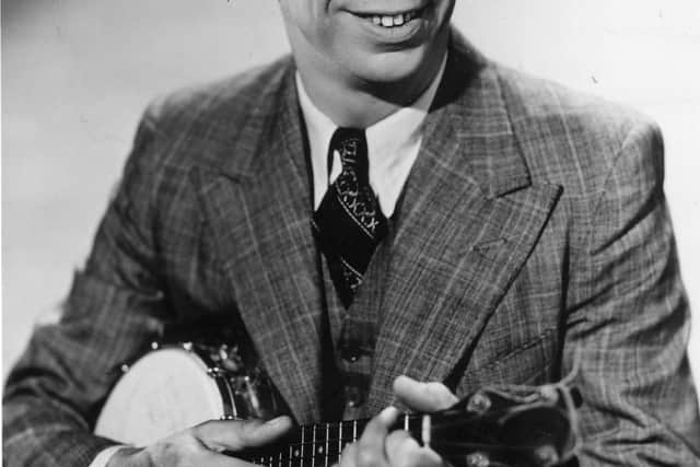 circa 1945:  Comic entertainer George Formby (1904 - 1961) playing a banjolele.  (Photo by Hulton Archive/Getty Images)