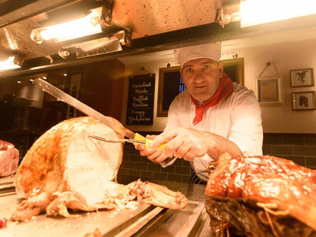 Carvery chef Ali Kozak carves the turkey inside the recently refurbished Toby Carvery in Morecambe. Photo: Kelvin Stuttard