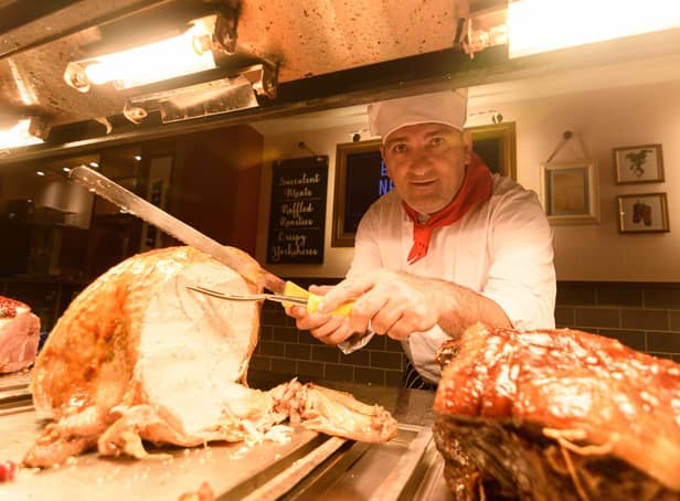 Carvery chef Ali Kozak carves the turkey inside the recently refurbished Toby Carvery in Morecambe. Photo: Kelvin Stuttard