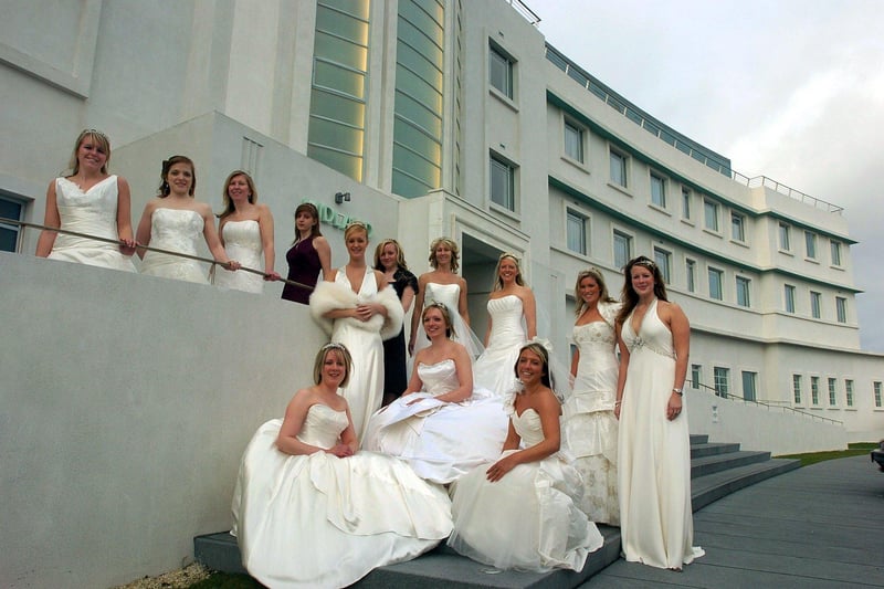 Mears Ghyll Bridal Rooms models pose outside the Midland Hotel staircase after a Wedding Fair fashion show.