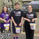 Collecting for the Music With The Mayor campaign.