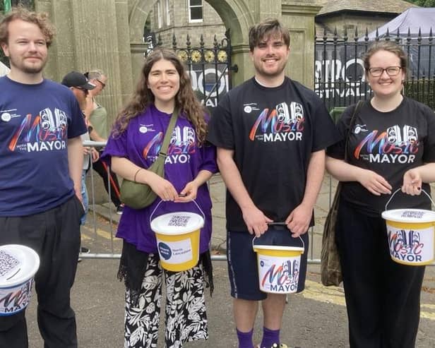 Collecting for the Music With The Mayor campaign.