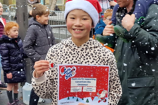 One youngster celebrates completing the Santa Dash.