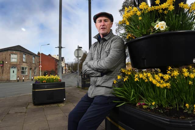 There is already plenty of floral colour at ground level in Adlington - but mayor Kevin O'Donnell wants the town's lampposts to continue to share in the annual summer spectacle