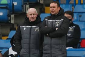 Derek Adams and John McMahon will take Morecambe to a private friendly at Huddersfield Town in July