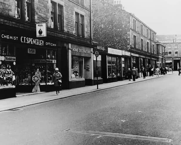 A view of Common Garden Street showing 1950s shops that are long gone.