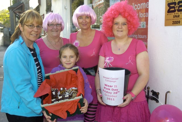 Staff from the Spar in Bolton-le-Sands, Emma Nolan, Marilyn Blackburn and Amanda Stephenson with customer Alison Baston and her daughter Ellie Baston, during a Wear It Pink Day held in the shop in aid of Breast Cancer Awareness.
