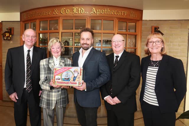 Singer Alfie Boe receiving a commemorative tin of Fisherman's Friend from Tony, Doreen, Duncan and Linda Lofthouse at the Fleetwood factory. Alfie recorded a series of popular TV  commercials for the lozenge company in 2016