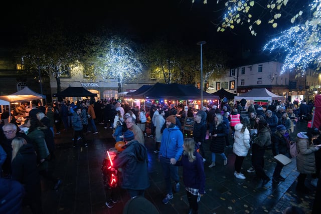 Crowds in Market Square at the food stalls set up for Light Up Lancaster.