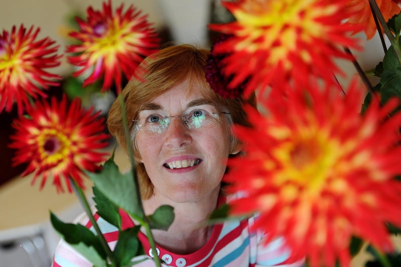 Christine Smith admires the winning cacti dahlias at Cockerham Village Show in 2016.