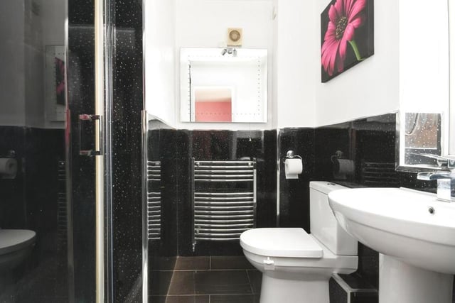 This is the slick en suite to the master bedroom, complete with walk-in shower cubicle.