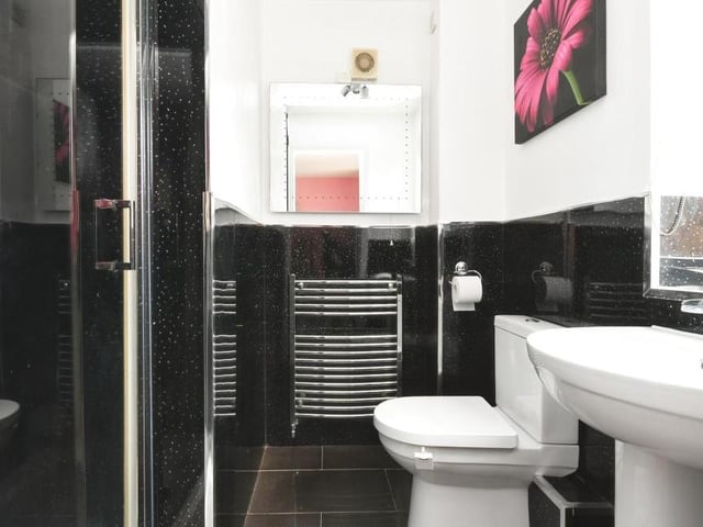 This is the slick en suite to the master bedroom, complete with walk-in shower cubicle.