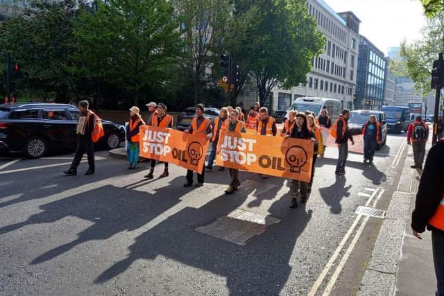 Just Stop Oil protestors on a march in the City of London. They are planning a march this Saturday in Lancaster.