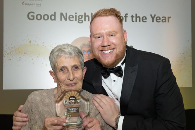 Good Neighbour of the Year award winner Diane Denby receives her award from Lee Harry Hitchmough, wedding and events manager of the Midland Hotel.