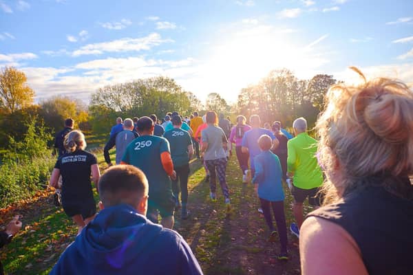 A group of people take part in parkrun