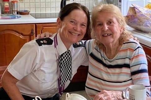 Chief Supt Karen Edwards visiting the victim in her home.