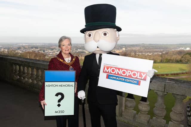 The Mayor of Lancaster Coun Joyce Pritchard with Mr Monopoly at the launch event of Lancaster's version of Monopoly. Photo: Kelvin Stuttard