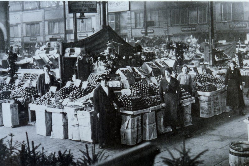 The Lancaster Market interior circa 1919, showing Parkinson’s stall with Christmas trees.