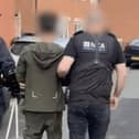 A man arrested by the National Crime Agency in Preston on Sunday has been charged with organising cross-Channel small boat crossings. Picture from the National Crime Agency.