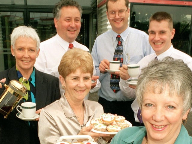 Organisers of a Heysham 2 Power Station coffee morning, Pauline Abbott (front right) and Chris Holland (centre), with Volunteer Coordinator at St John's Hospice Jean Lawrence (left) and power station workers. The coffee morning raised £340 for The Macmillan Nurse Appeal.