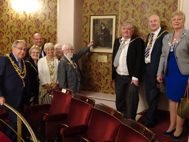 Mayor of Lancaster, Coun Roger Mace, shows the picture of his ancestor, actress Sarah Siddons, to local dignitaries in the circle alcove at Lancaster Grand Theatre.