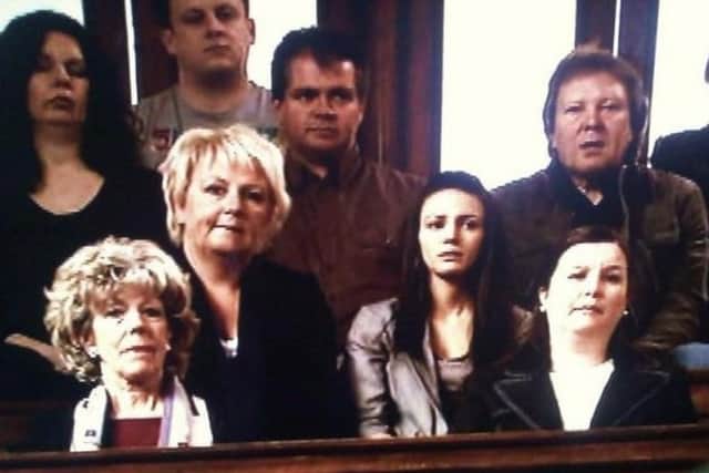 Graham Burton in the public gallery in a scene from Gail's trial in Coronation Street.