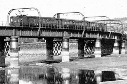 An electric passenger train crosses Greyhound Bridge en route for Morecambe and Heysham. Photo courtesy of Lancaster Past & Present