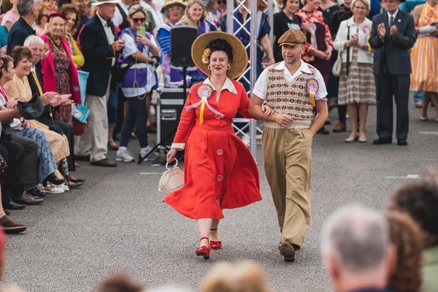 A couple walk arm in arm at the vintage fashion show at the vintage festival at the weekend. Picture by Robin Zahler.