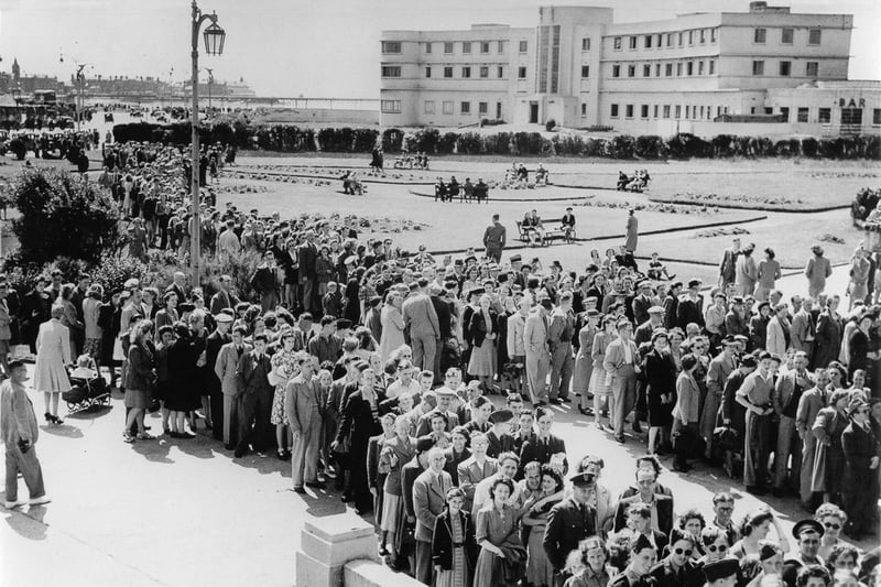 Crowds waiting to get into the Super Swimming Stadium for a bathing beauty contest circa 1945.