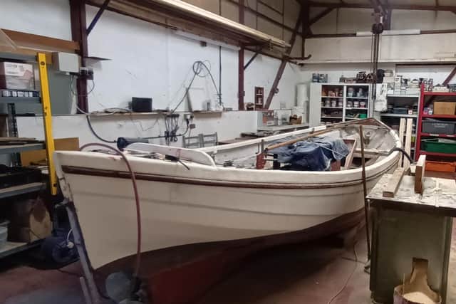 A traditional Whammel boat has been restored by Lancaster Port Commission marine staff.