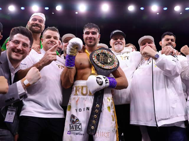 Bob Howard, to the left of Tommy Fury, celebrates victory in Saudi Arabia.
